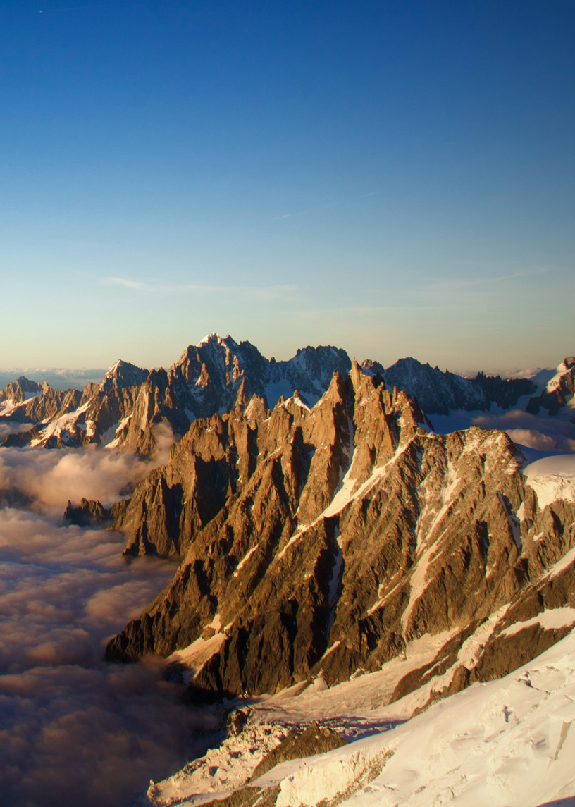 A mountain range with snow covered peaks and clouds in the sky.

AI generated content